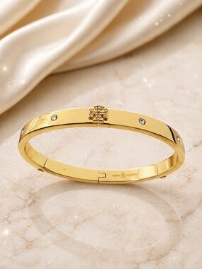 TORY BURCH Pace Logo Hinged Bangle with Crystals.
